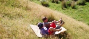 Sliding_down_grass_slope