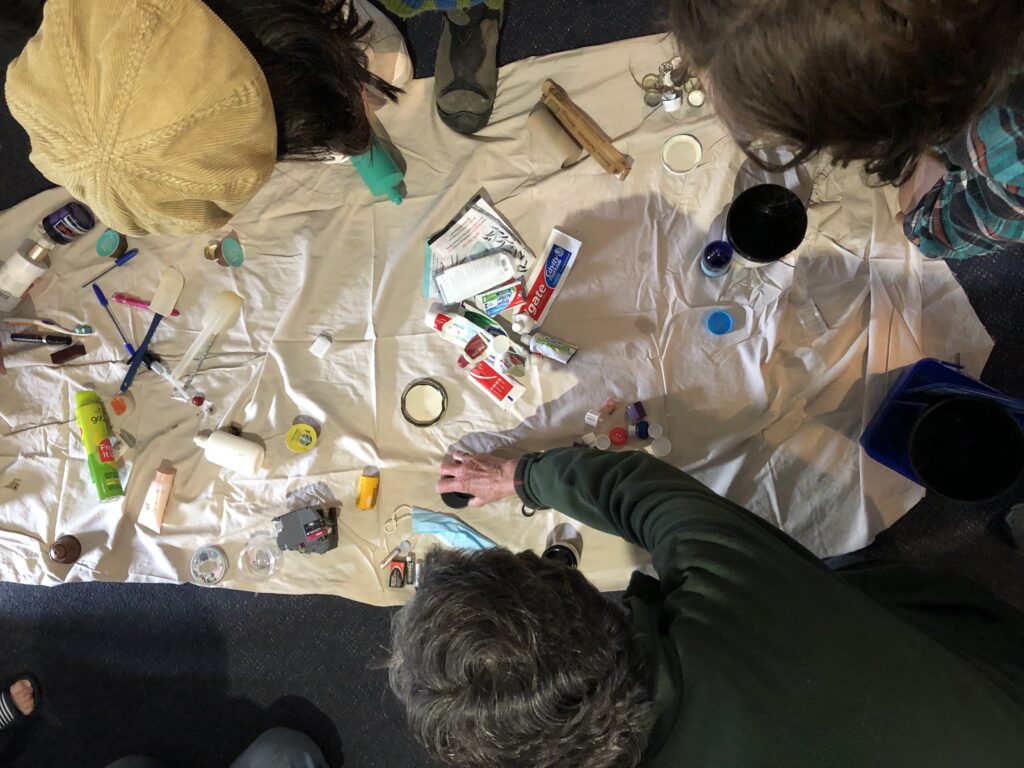 People sorting through waste products